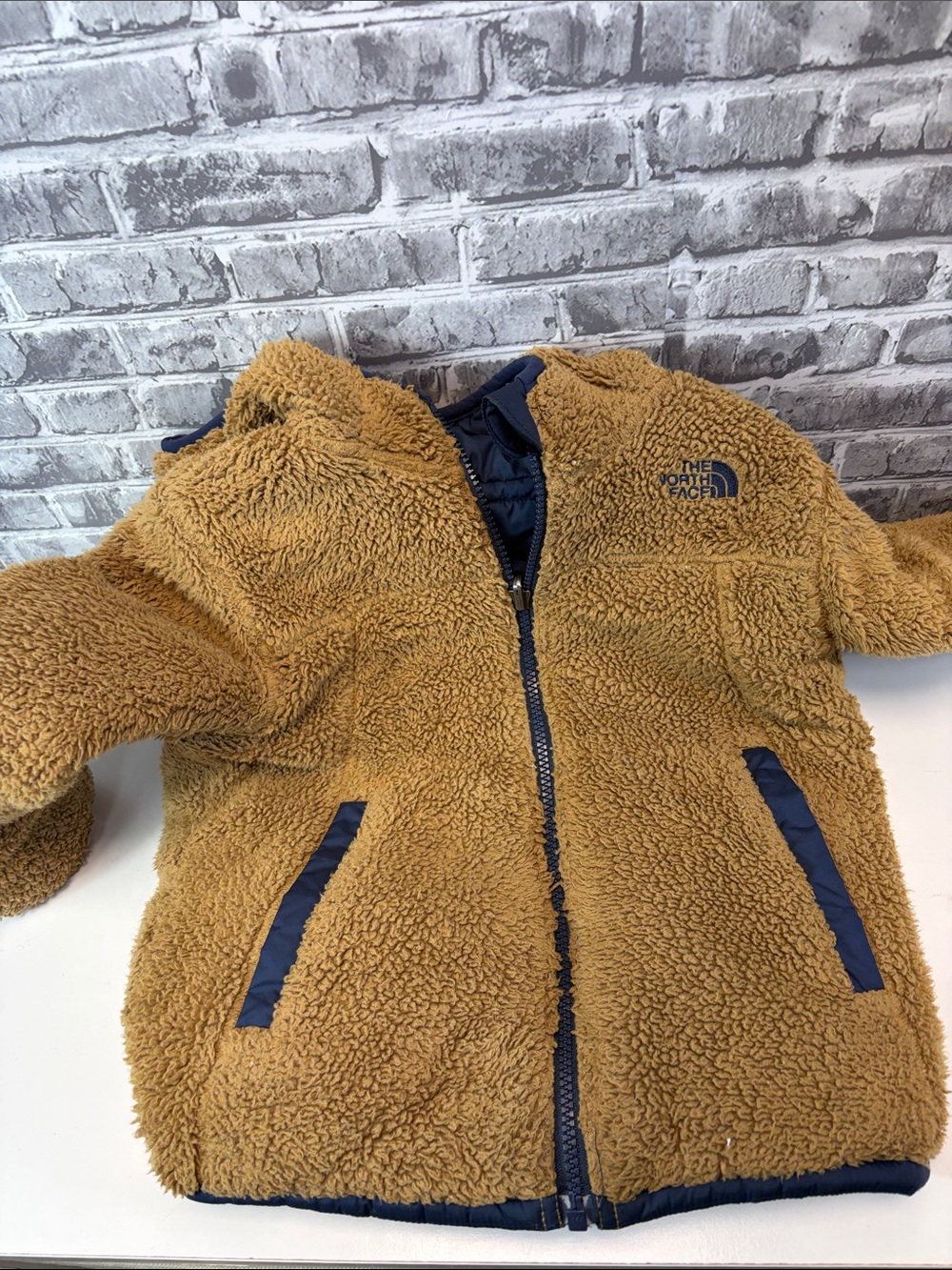 The North Face Kids Navy Blue Quilted Puffer Jacket with Sherpa Hood reversible - Picture 8 of 9